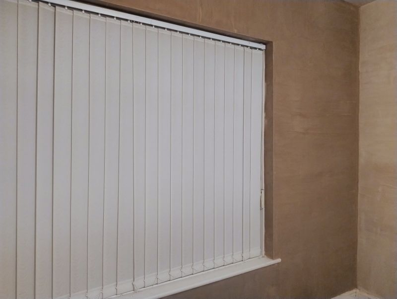 Experienced plasterer in Leigh completing internal wall skimming for a property in Greater Manchester