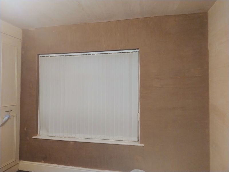 Professional plastering services in Leigh with clean wall preparation and a polished skim coat finish